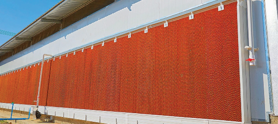 Insulated house with RainMaker cooling pad for improved climate control